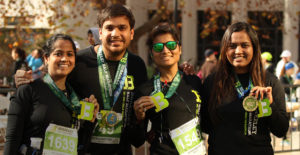 A group of people enjoy the Berkeley Half Marathon together. Find people to run with.