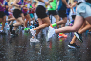 How to stay motivated even when the weather turns? Runners running in the rain.